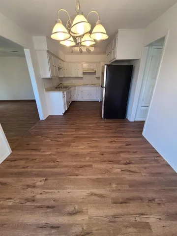 a view of fireplace with wooden floor