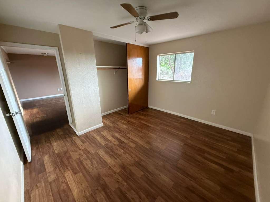 1955 East 8th Street, Unit 1 Douglas, AZ 85607 - Photo 15 of 16 wooden floor in an empty room with a window