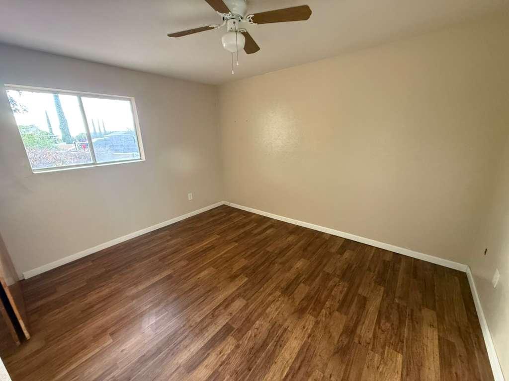1955 East 8th Street, Unit 1 Douglas, AZ 85607 - Photo 16 of 16 a view of a room with wooden floor and windows