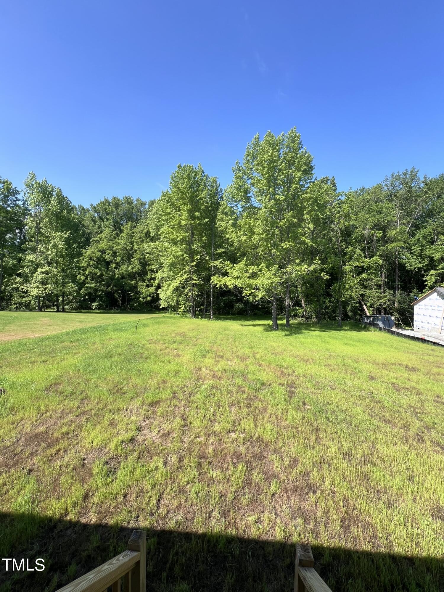 339 Bushel Lane Willow Spring, NC 27592 - Photo 18 of 18 a view of a yard with an outdoor space