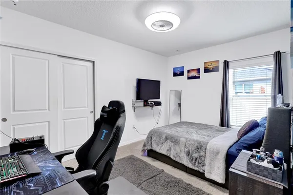 a bedroom with a bed and furniture