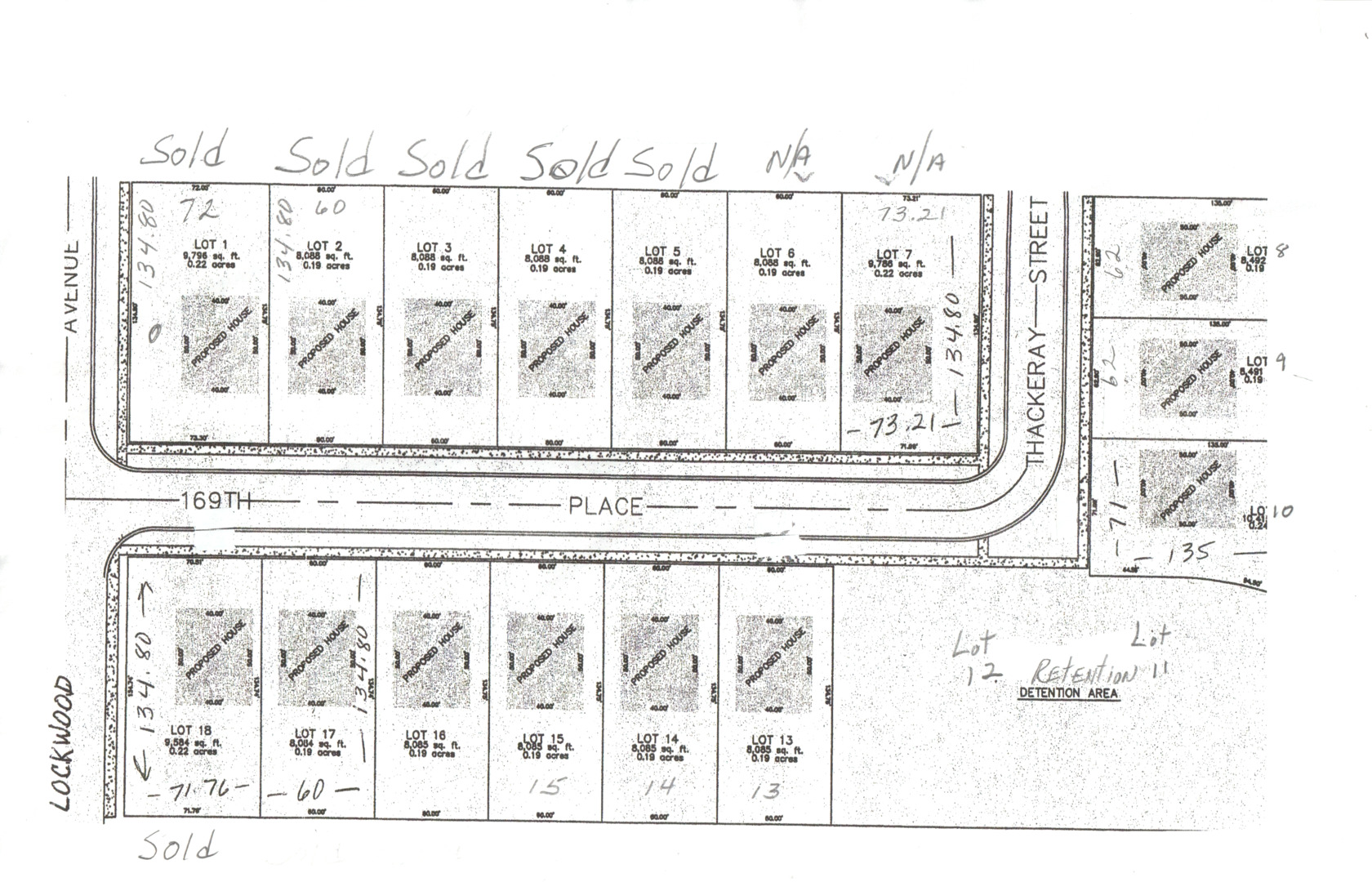 a black white and white photo of a living room