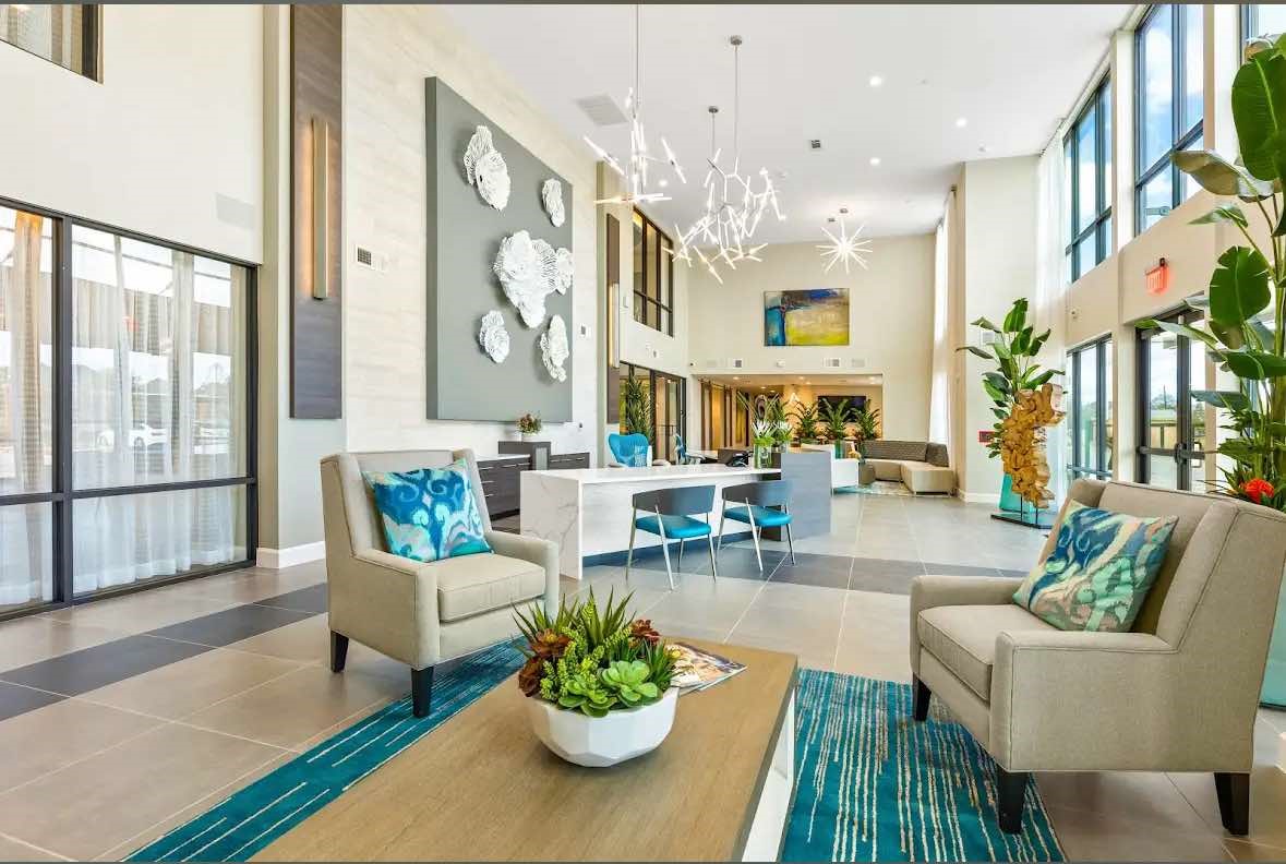 7204 Town Center Boulevard, Unit B2 Rosenberg, TX 77471 - Photo 8 of 12 a living room with furniture and a large window