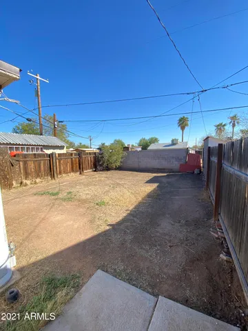 a view of a swimming pool with an outdoor seating