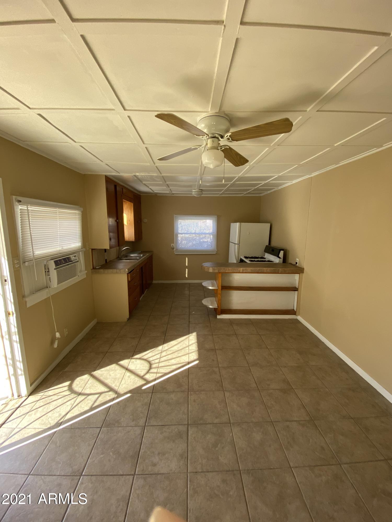 1037 North 25th Street, Unit 2 Phoenix, AZ 85008 - Photo 2 of 18 a view of kitchen with furniture and refrigerator
