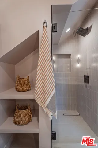 a bathroom with a bathtub and shower
