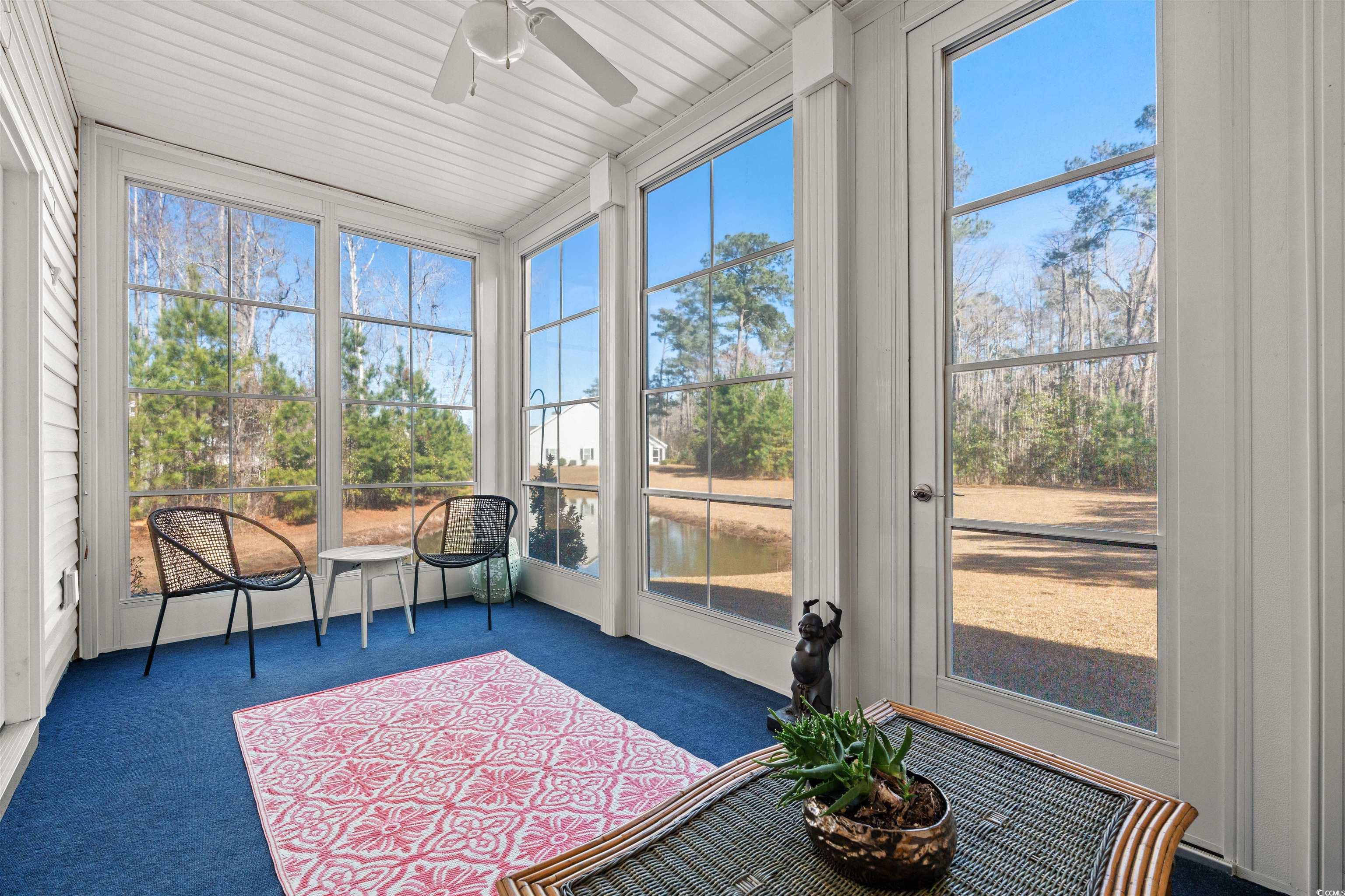 933 Jackline Place, Unit 101 Murrells Inlet, SC 29576 - Photo 11 of 35 Sunroom with a wealth of natural light and a ceili