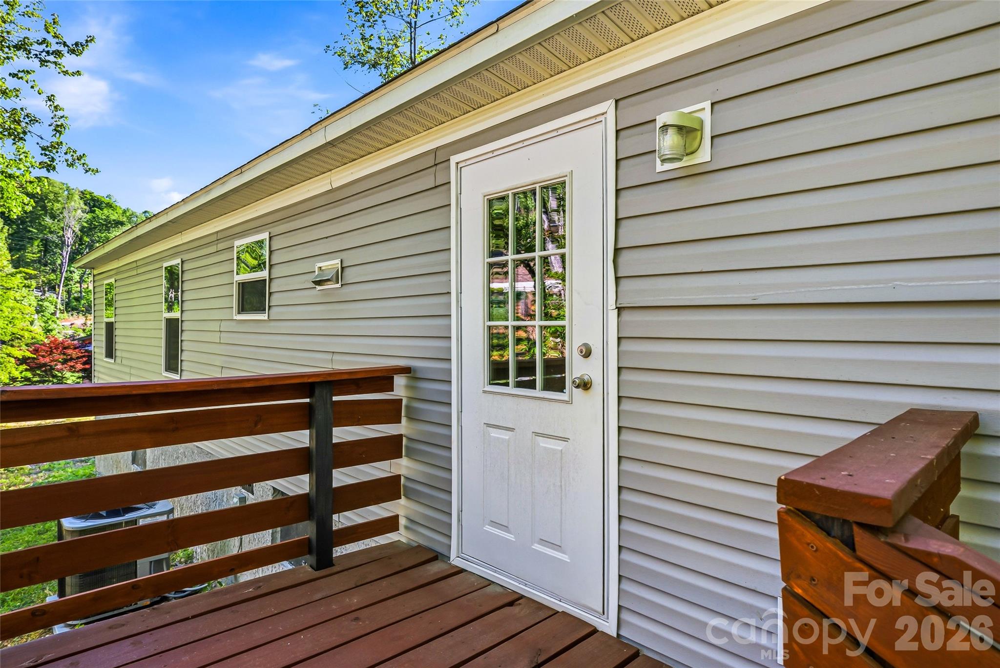 45 Alan Retreat Road Hendersonville, NC 28792 - Photo 14 of 25 a view of a house with wooden deck