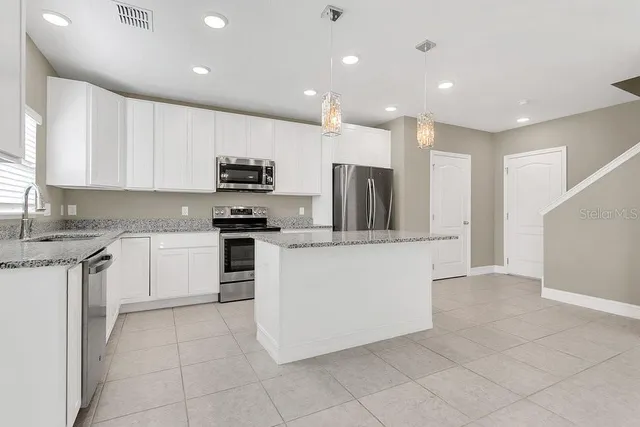 a bathroom with a sink a mirror and vanity