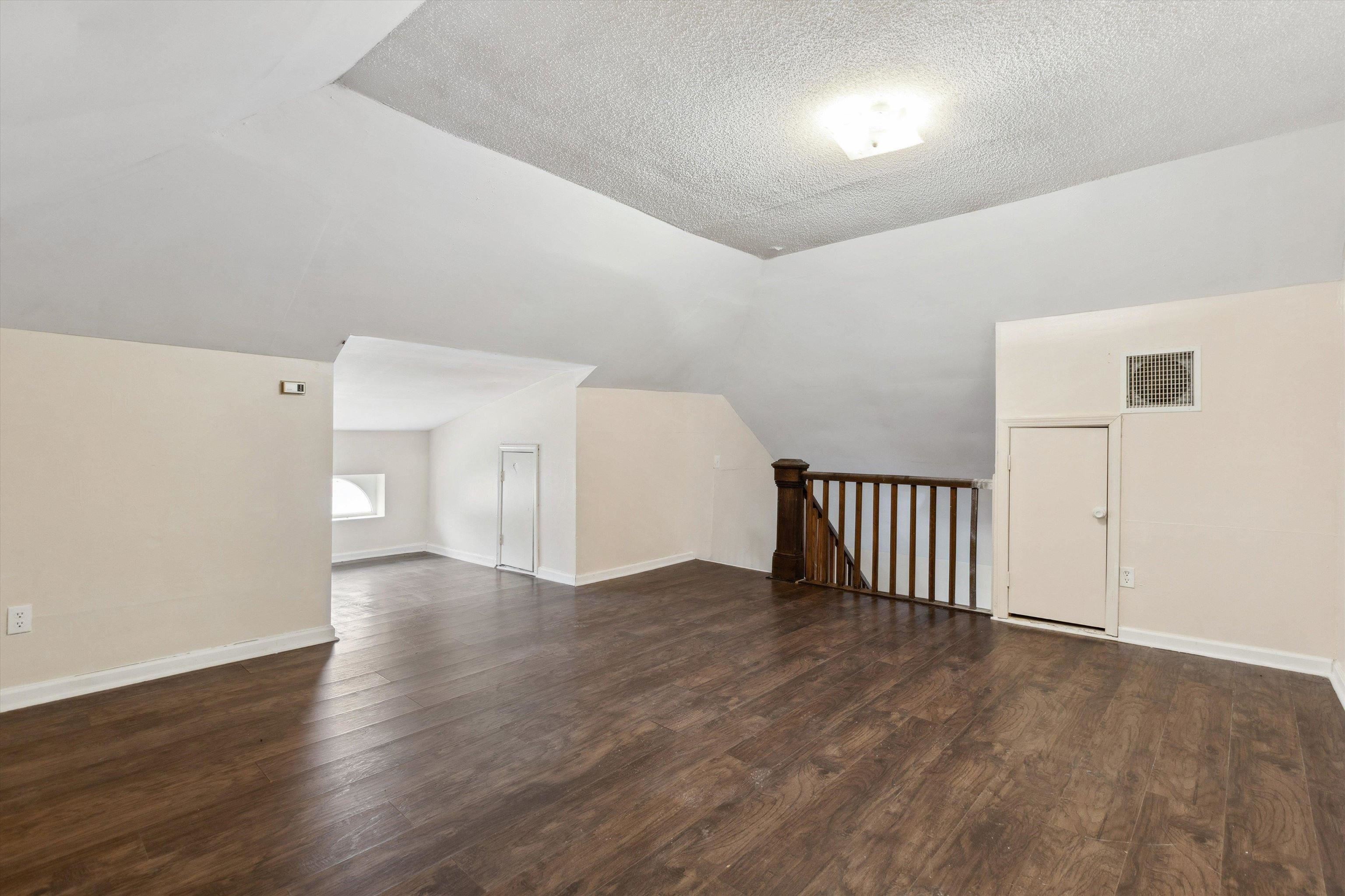 8457 East Kerrville Rosemark Road Millington, TN 38053 - Photo 23 of 32 Bonus room with dark wood-style floors and baseboards