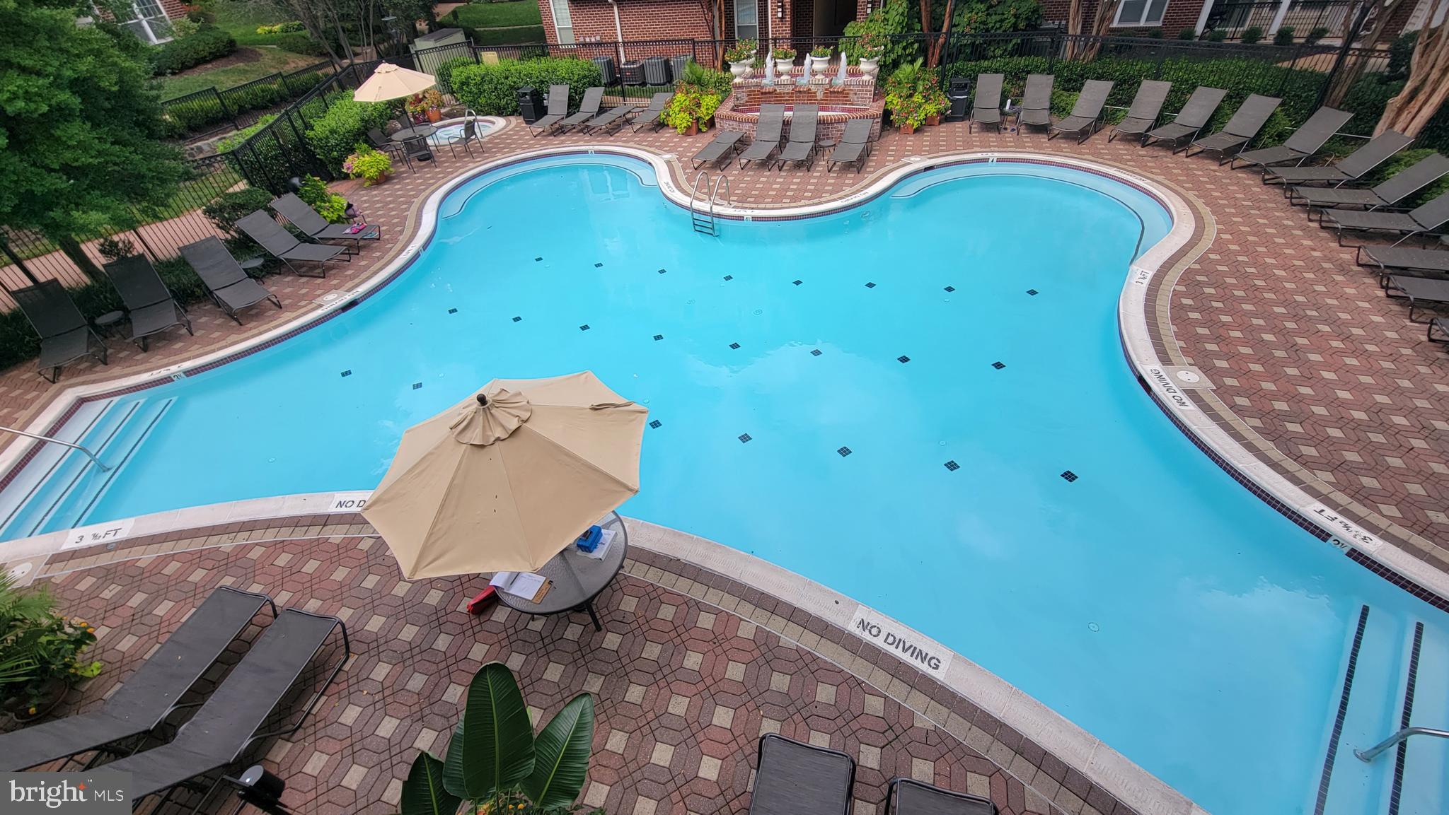 1591 Spring Gate Dr., Unit 3315 McLean, VA 22102 - Photo 45 of 69 VIEW OF THE POOL FROM CLUBHOUSE BALCONY