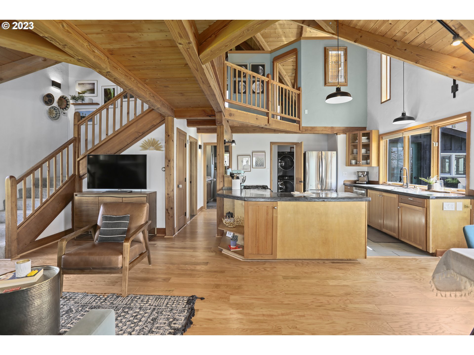 238 Acme Road White Salmon, WA 98672 - Photo 11 of 48 a view of a living room kitchen and a wooden floor