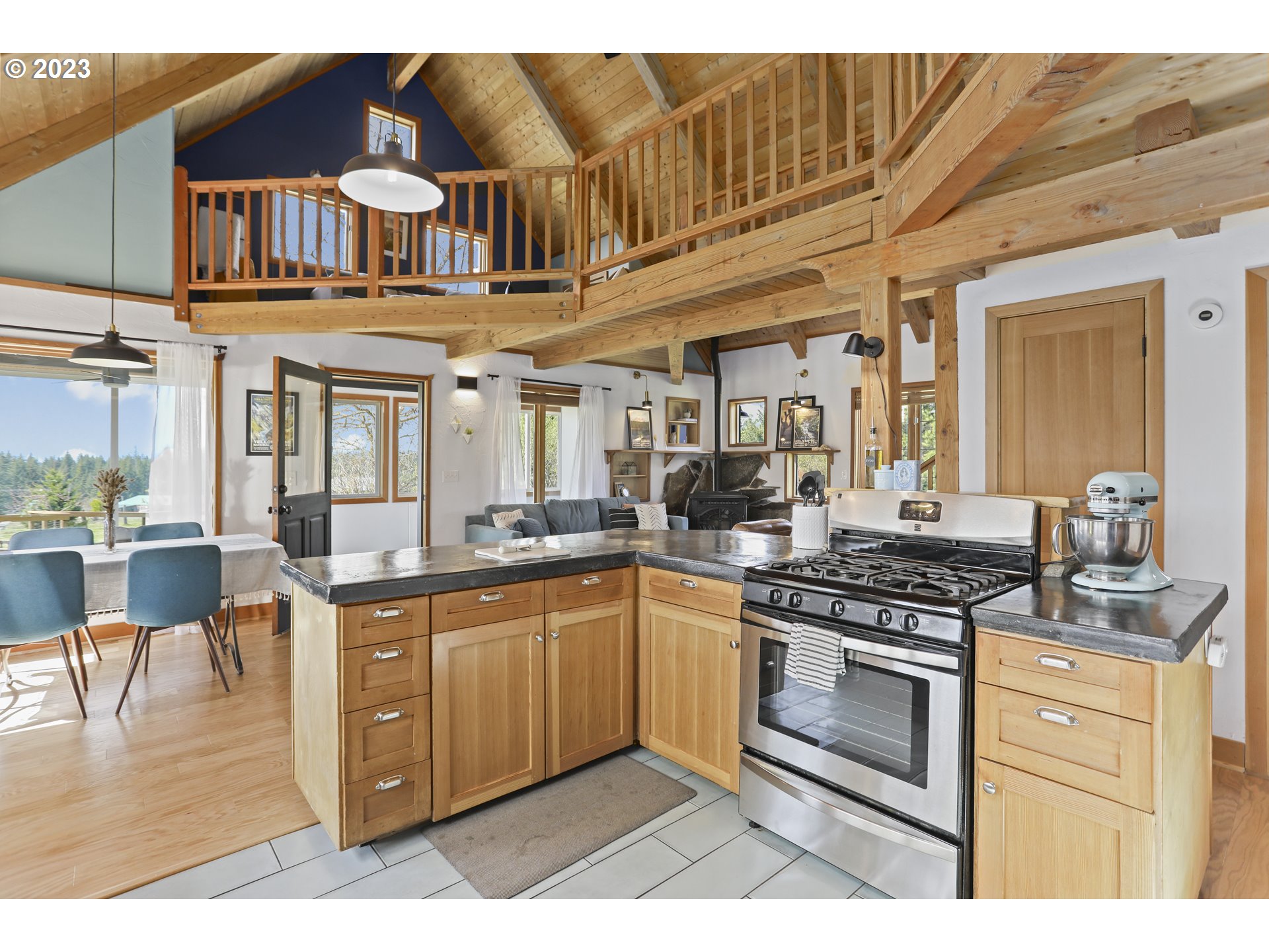 238 Acme Road White Salmon, WA 98672 - Photo 13 of 48 a kitchen with stainless steel appliances granite countertop a stove and a sink