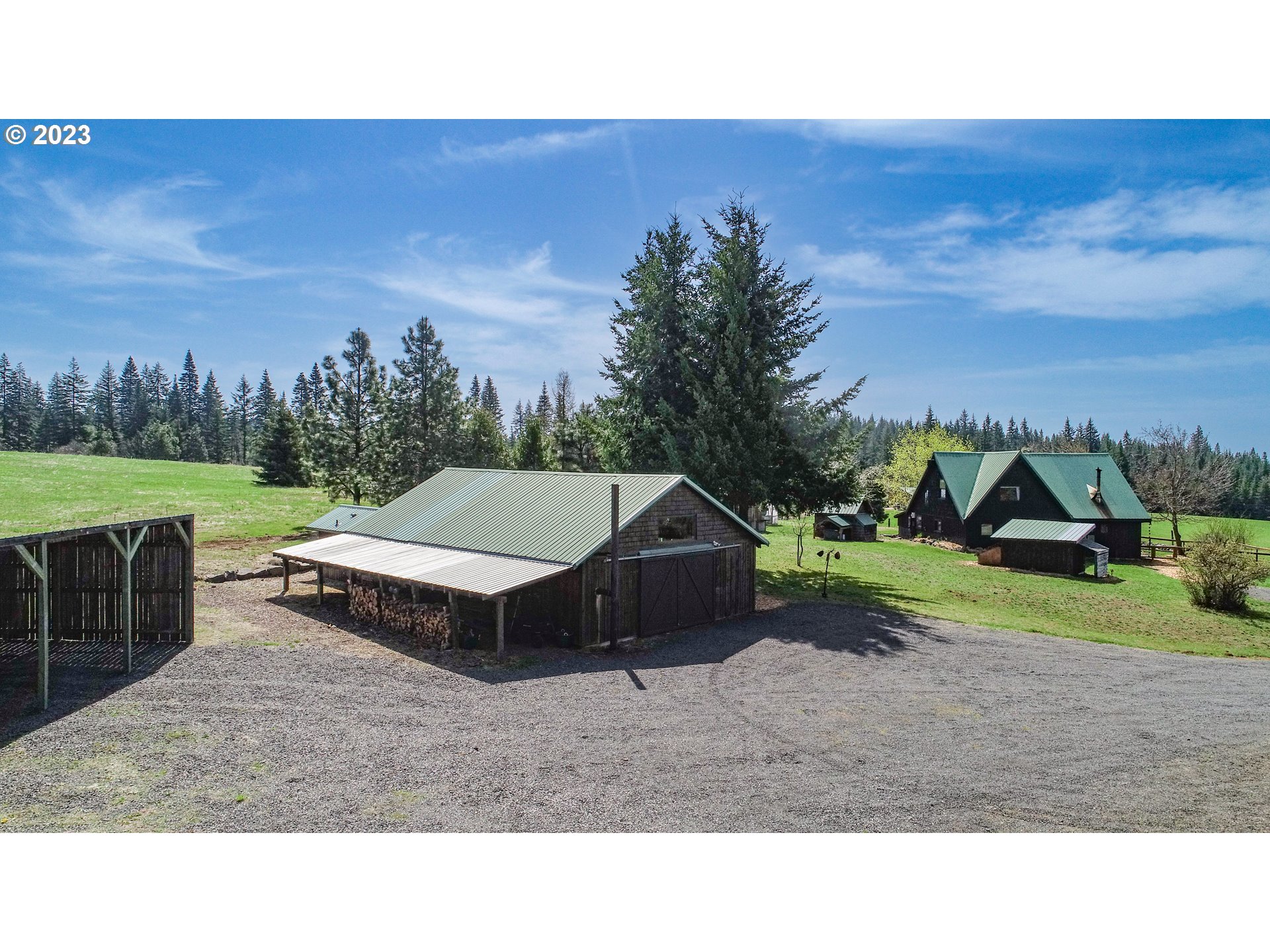 238 Acme Road White Salmon, WA 98672 - Photo 29 of 48 a backyard of a house with a yard and outdoor seating