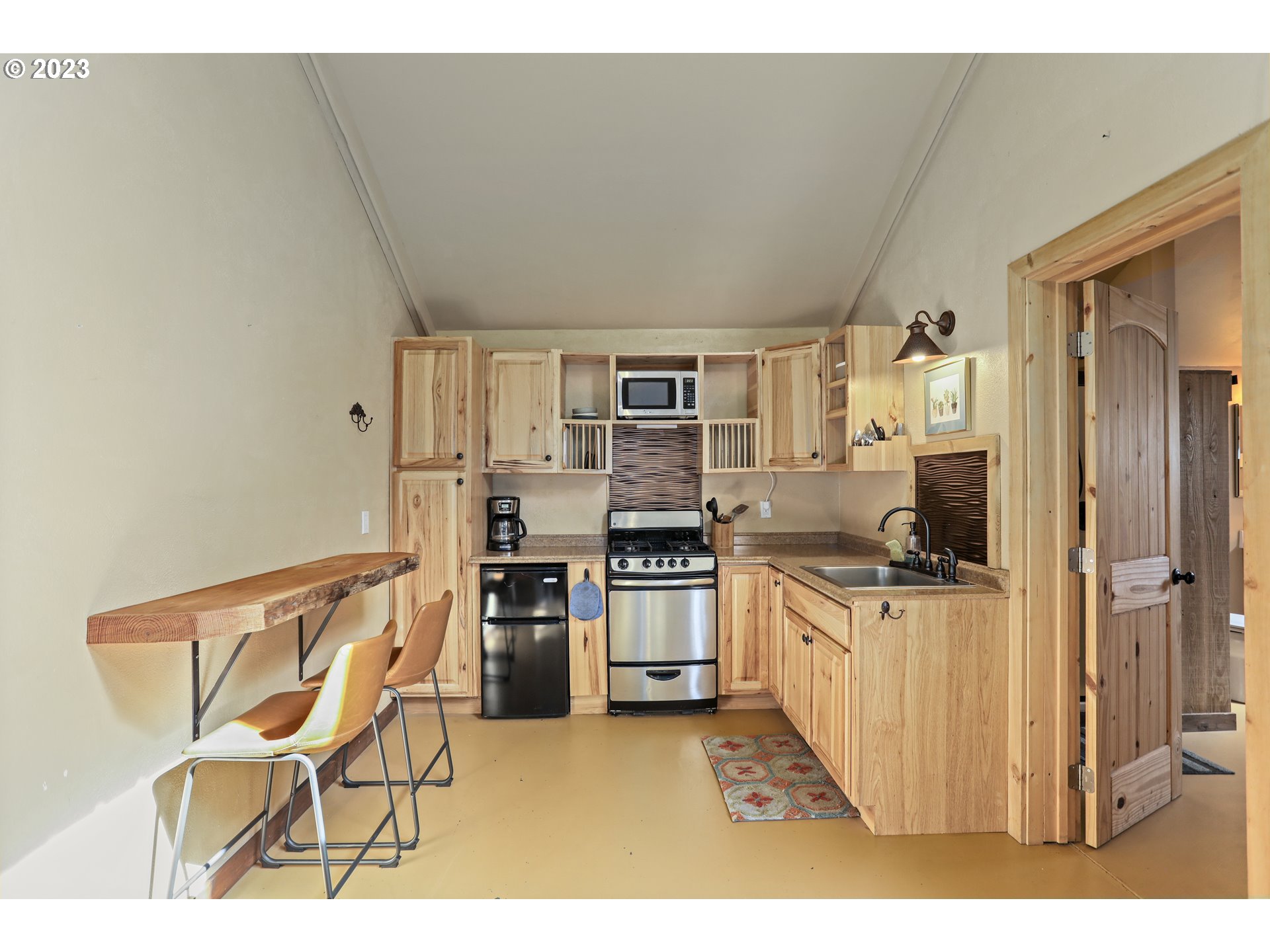 238 Acme Road White Salmon, WA 98672 - Photo 32 of 48 a kitchen with cabinets and wooden floor