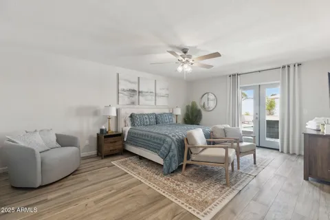 a bedroom with a bed furniture and a potted plant