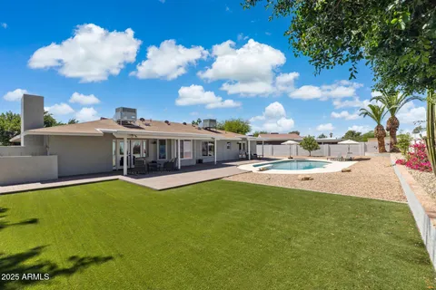 a view of a swimming pool with lounge chair