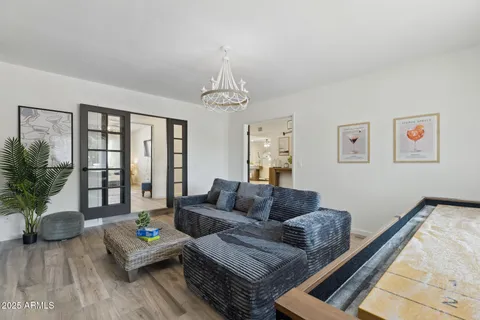 a view of a hallway view with wooden floor and staircase