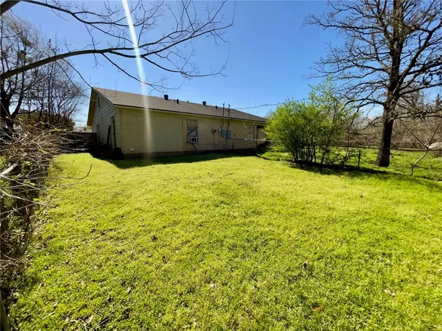 a view of a backyard of the house