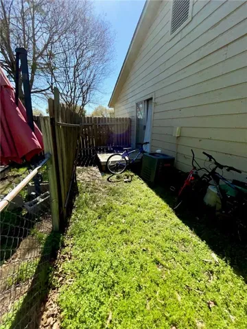 a view of a backyard with sitting area