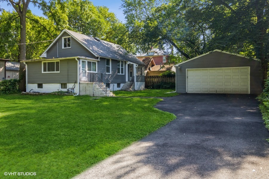 105 Grove Avenue Fox River Grove, IL 60021 - Photo 1 of 16 a front view of house with yard and green space