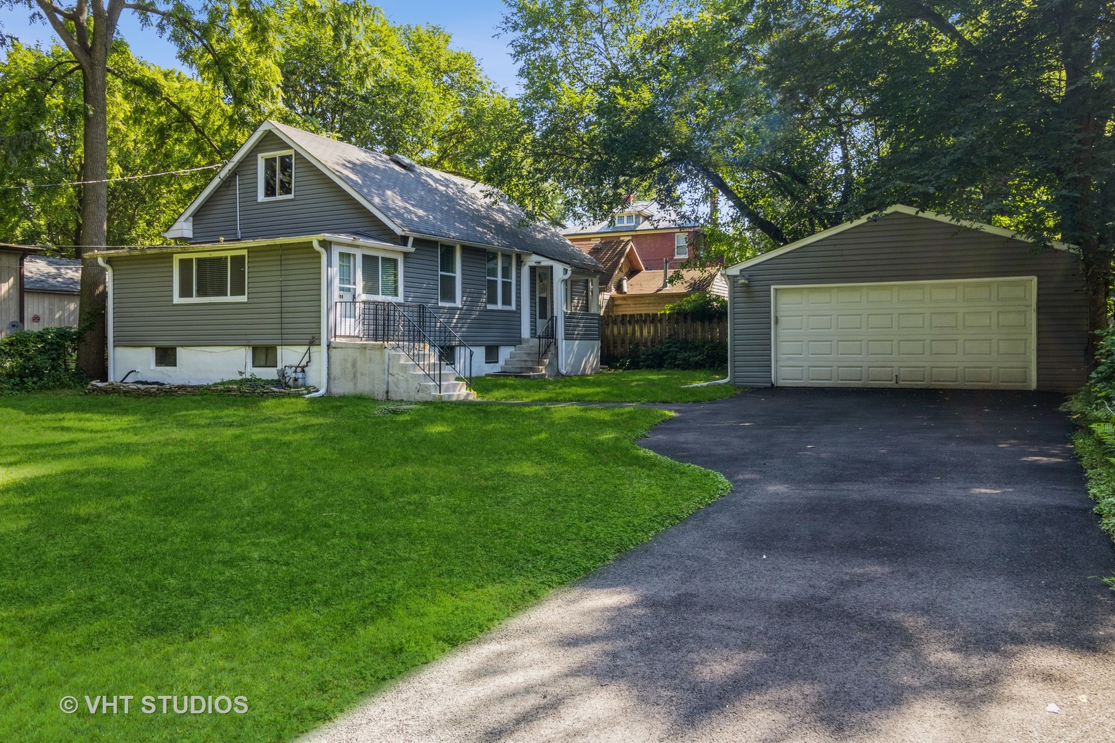 105 Grove Avenue Fox River Grove, IL 60021 - Photo 2 of 16 a front view of house with yard and green space