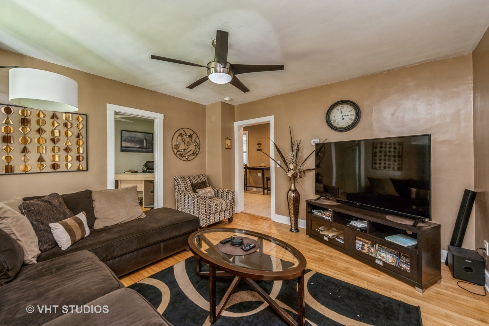 105 Grove Avenue Fox River Grove, IL 60021 - Photo 3 of 16 a living room with furniture and a flat screen tv