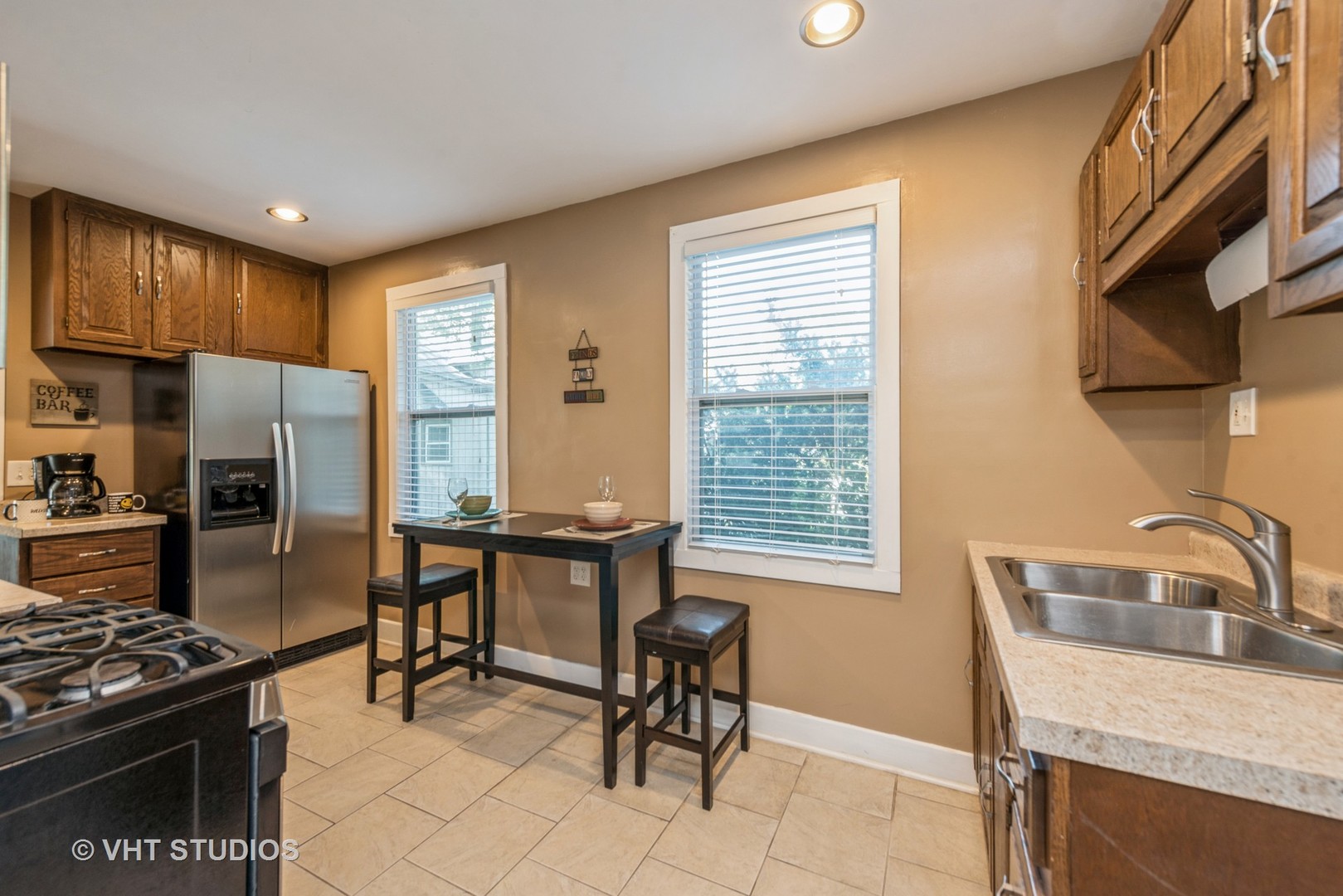 105 Grove Avenue Fox River Grove, IL 60021 - Photo 4 of 16 a kitchen with granite countertop a sink cabinets and stainless steel appliances