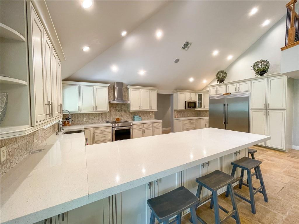 12990 Southwest 56th Street Southwest Ranches, FL 33330 - Photo 13 of 62 a large kitchen with a table and chairs