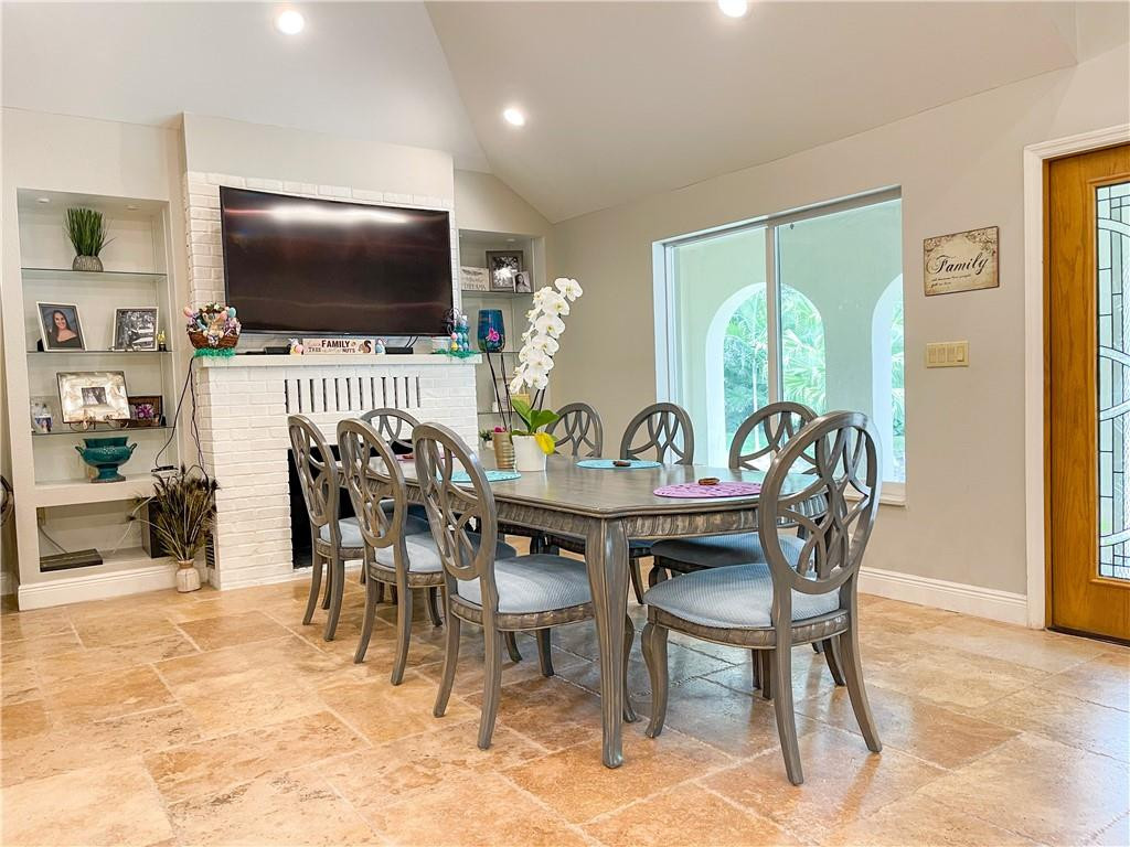 12990 Southwest 56th Street Southwest Ranches, FL 33330 - Photo 16 of 62 a dining room with furniture and a flat screen tv