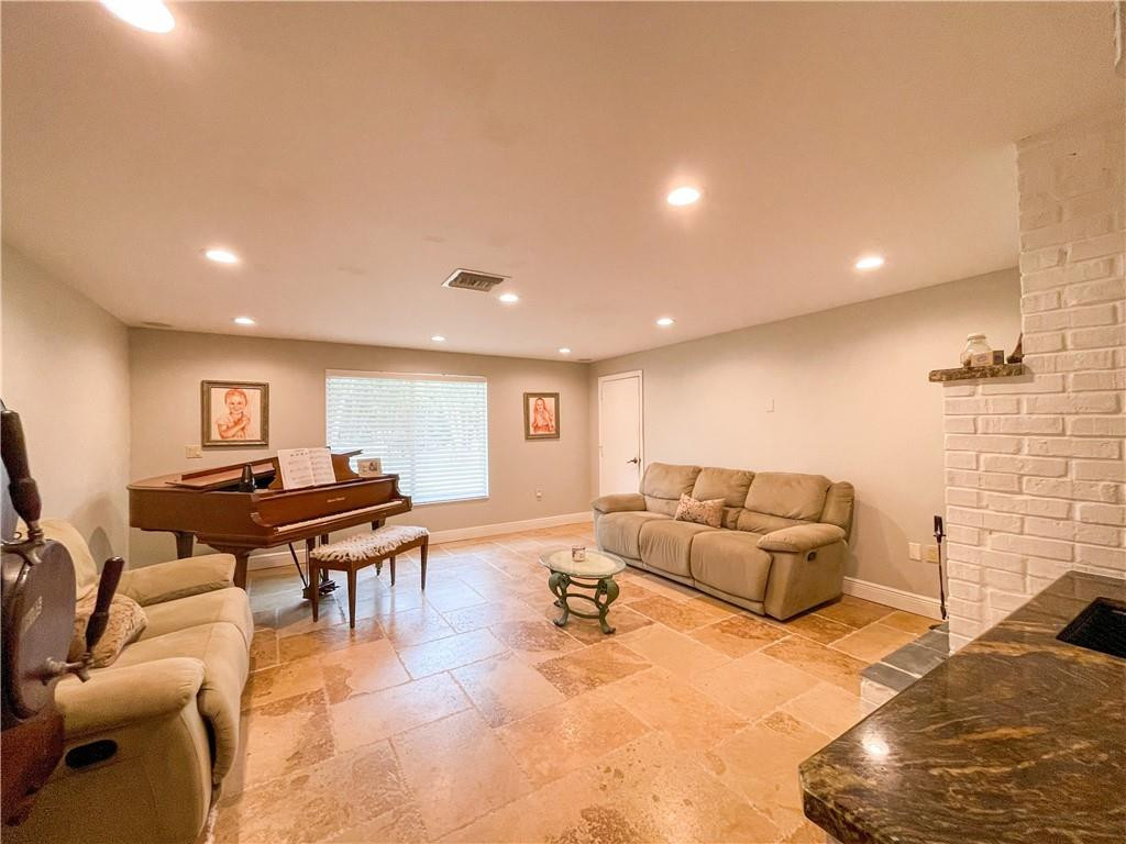 12990 Southwest 56th Street Southwest Ranches, FL 33330 - Photo 25 of 62 a living room with furniture and a wooden floor