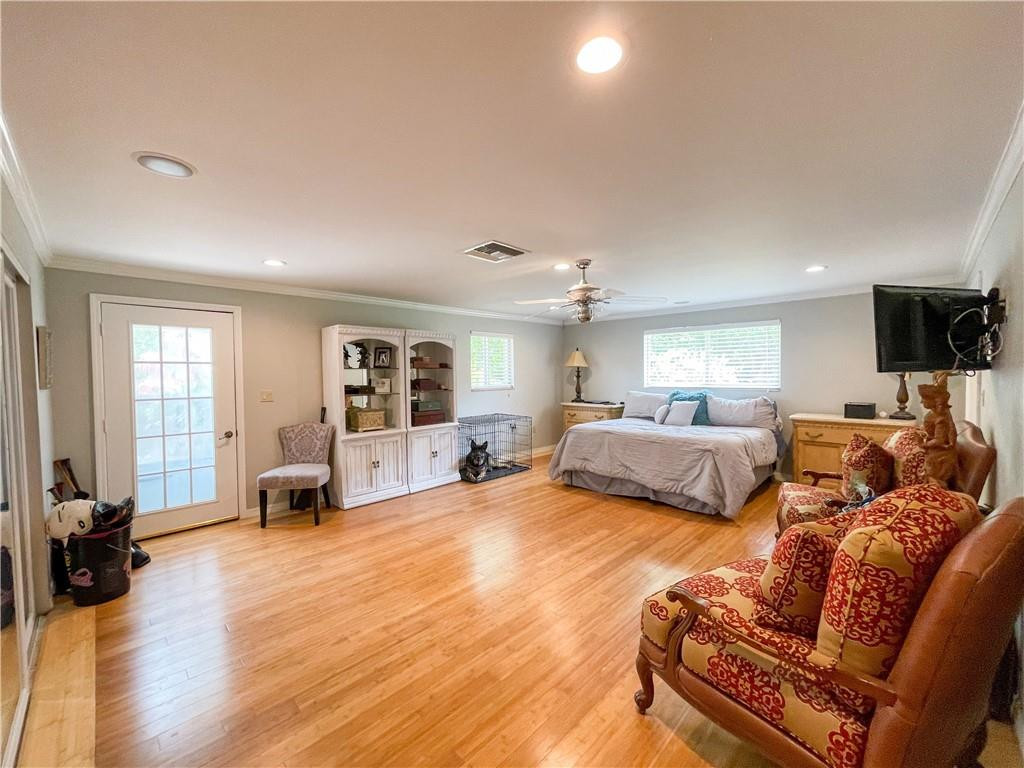 12990 Southwest 56th Street Southwest Ranches, FL 33330 - Photo 28 of 62 a bed room with furniture and a flat screen tv