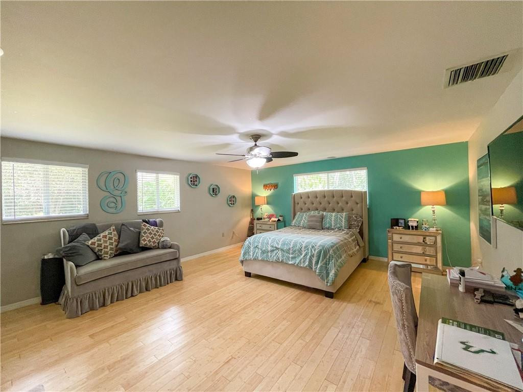 12990 Southwest 56th Street Southwest Ranches, FL 33330 - Photo 34 of 62 a living room with furniture and a flat screen tv