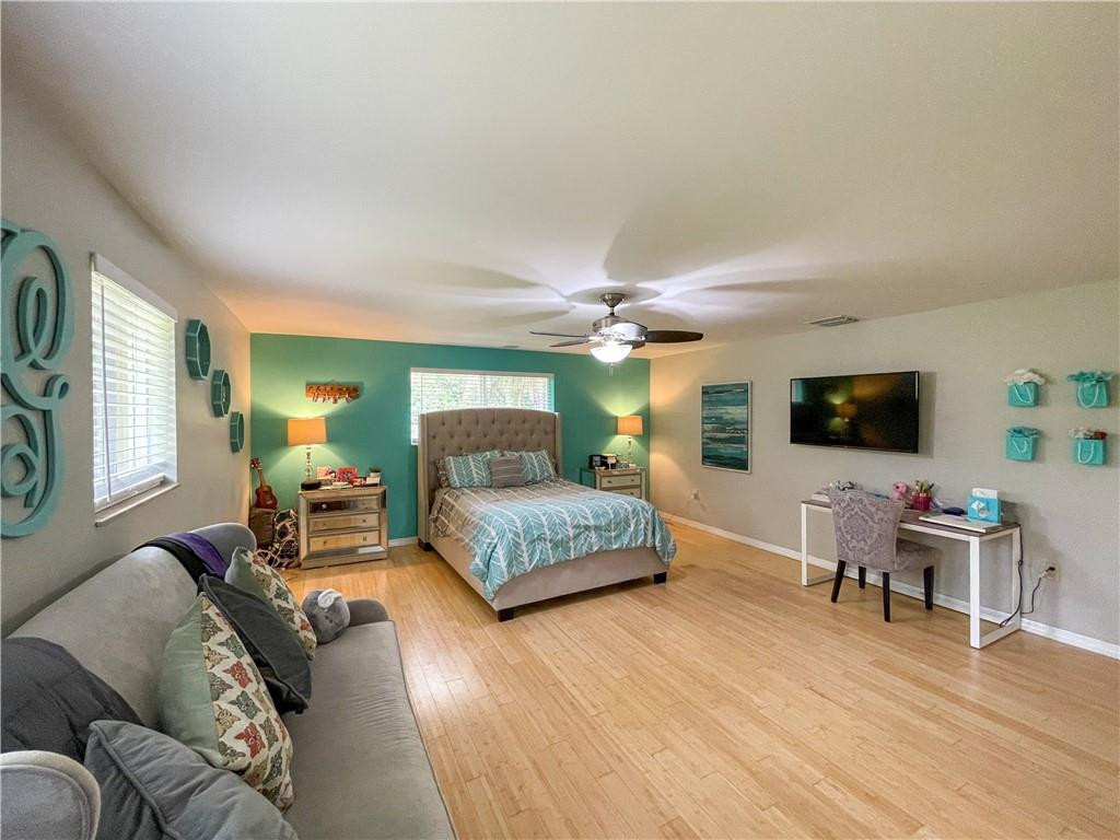 12990 Southwest 56th Street Southwest Ranches, FL 33330 - Photo 36 of 62 a living room with furniture and a flat screen tv