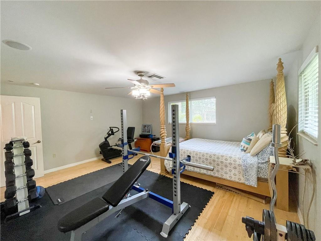 12990 Southwest 56th Street Southwest Ranches, FL 33330 - Photo 39 of 62 a bedroom with furniture and a window