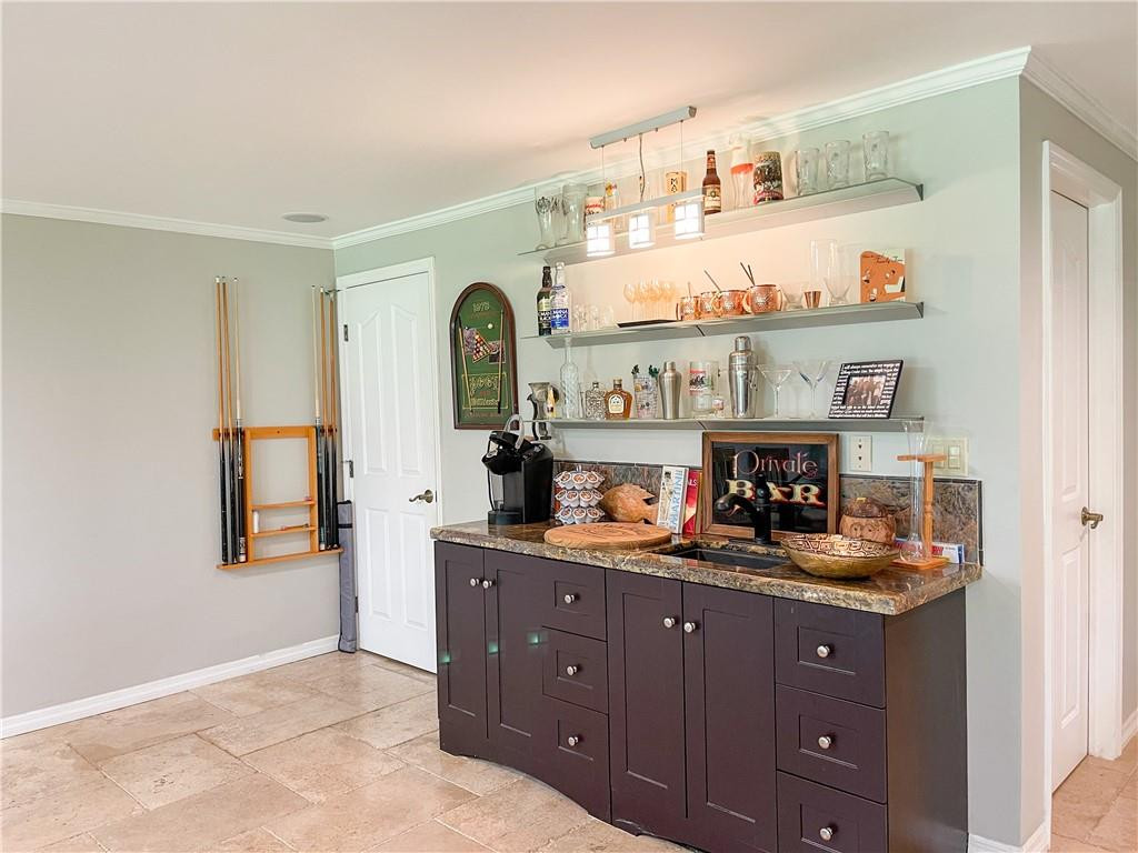 12990 Southwest 56th Street Southwest Ranches, FL 33330 - Photo 42 of 62 a kitchen with granite countertop lots of clutter and stainless steel appliances