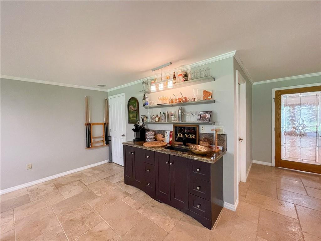12990 Southwest 56th Street Southwest Ranches, FL 33330 - Photo 43 of 62 a kitchen with granite countertop a stove and cabinets