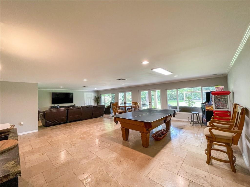 12990 Southwest 56th Street Southwest Ranches, FL 33330 - Photo 44 of 62 a living room with furniture and a flat screen tv