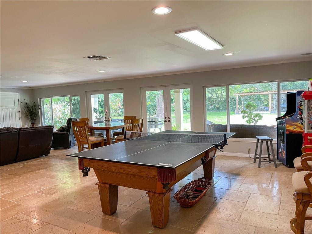 12990 Southwest 56th Street Southwest Ranches, FL 33330 - Photo 46 of 62 a room with furniture a table and a large window