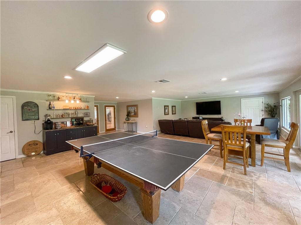 12990 Southwest 56th Street Southwest Ranches, FL 33330 - Photo 49 of 62 a living room with furniture a flat screen tv and a large window