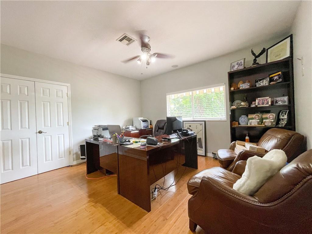 12990 Southwest 56th Street Southwest Ranches, FL 33330 - Photo 55 of 62 a living room with furniture window and flat screen tv
