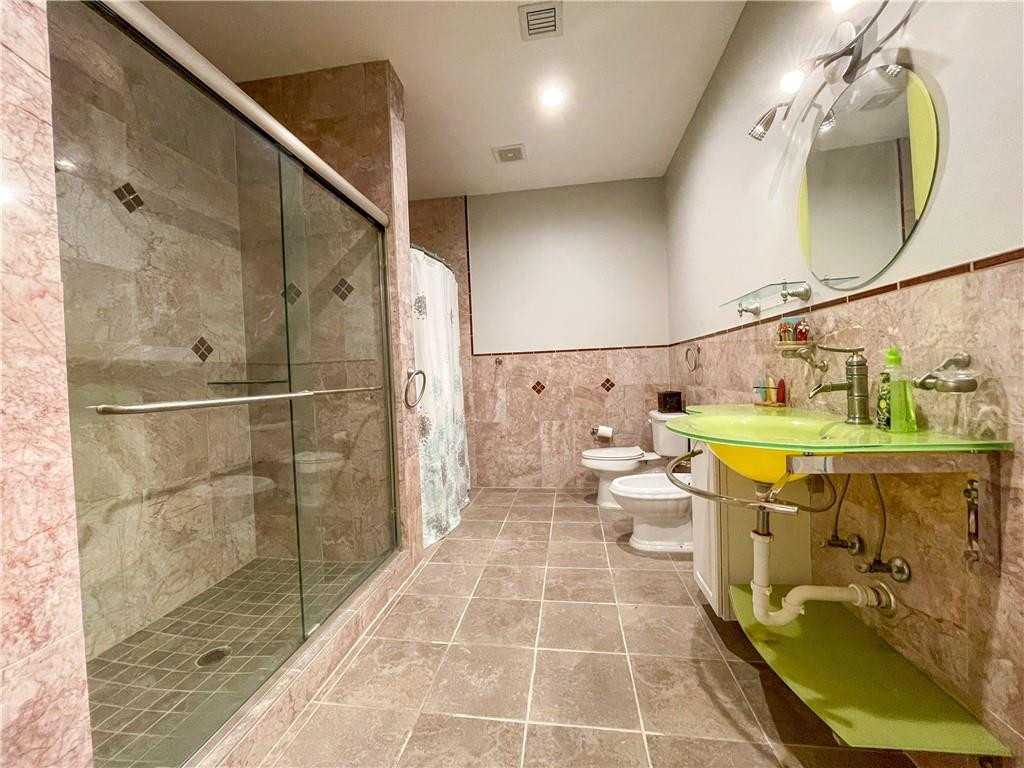 12990 Southwest 56th Street Southwest Ranches, FL 33330 - Photo 56 of 62 a bathroom with a sink a toilet and shower