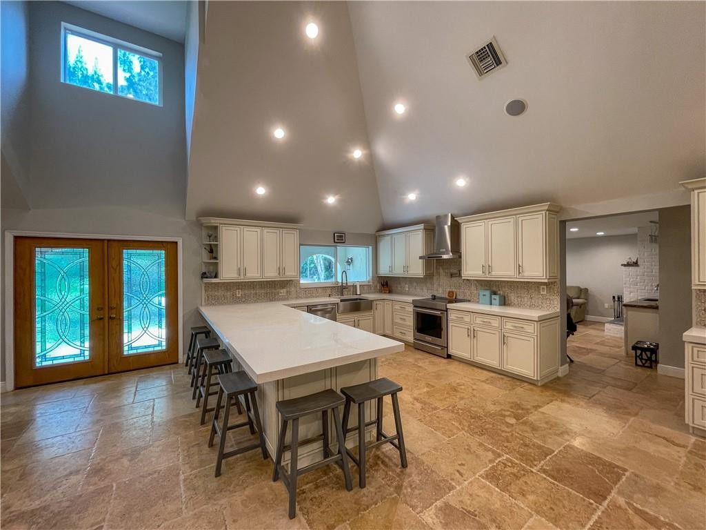 12990 Southwest 56th Street Southwest Ranches, FL 33330 - Photo 6 of 62 a kitchen with a table and chairs in it