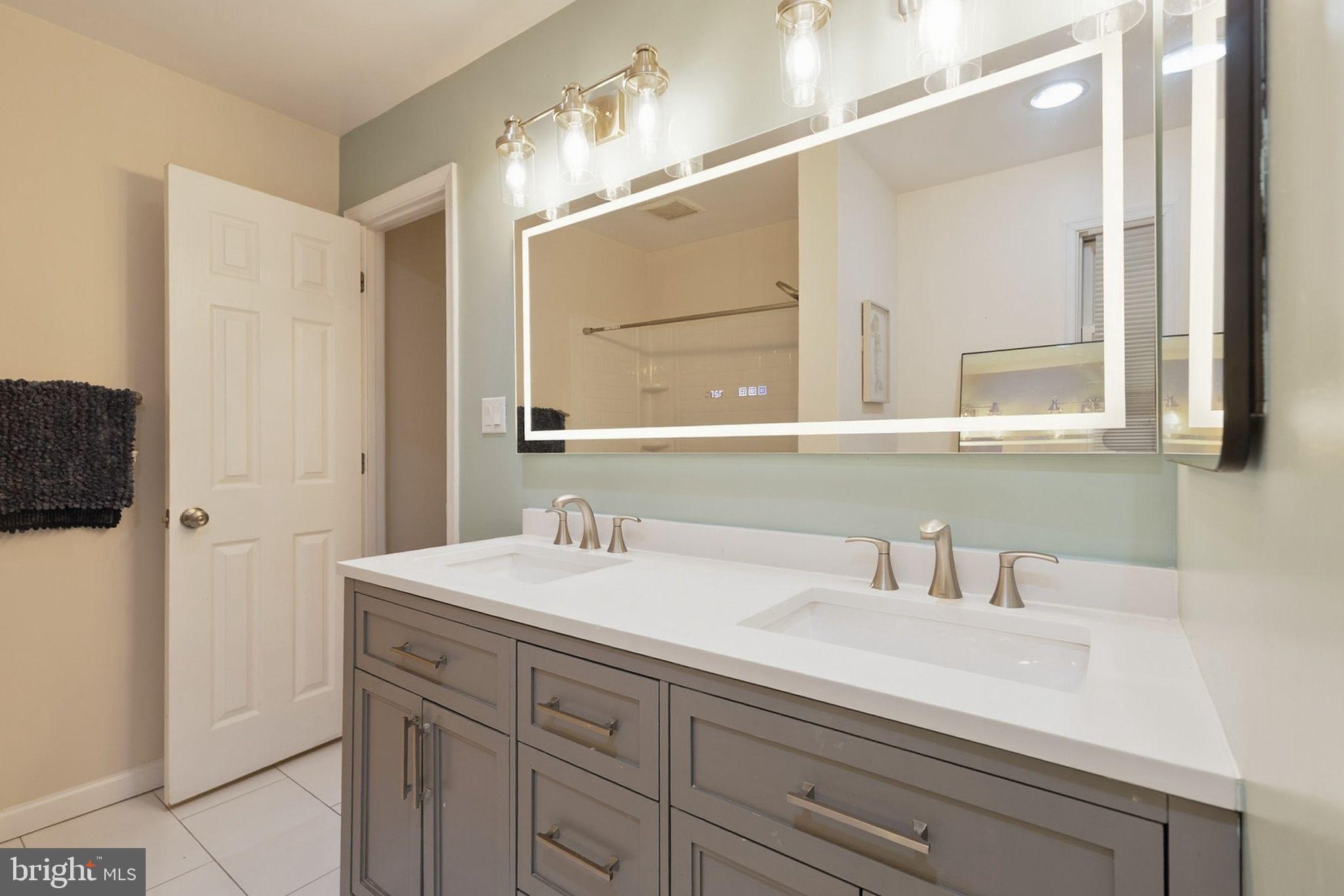 358 Kimwood Road Arnold, MD 21012 - Photo 14 of 15 a bathroom with a sink and a mirror