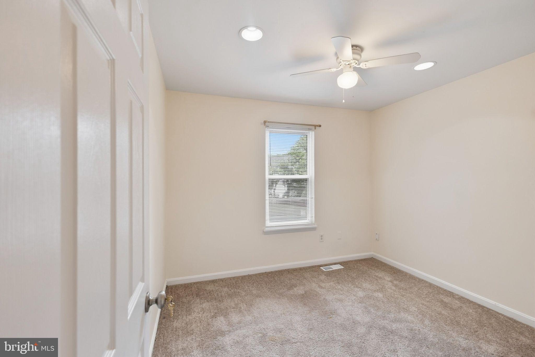358 Kimwood Road Arnold, MD 21012 - Photo 8 of 15 an empty room with windows and fan