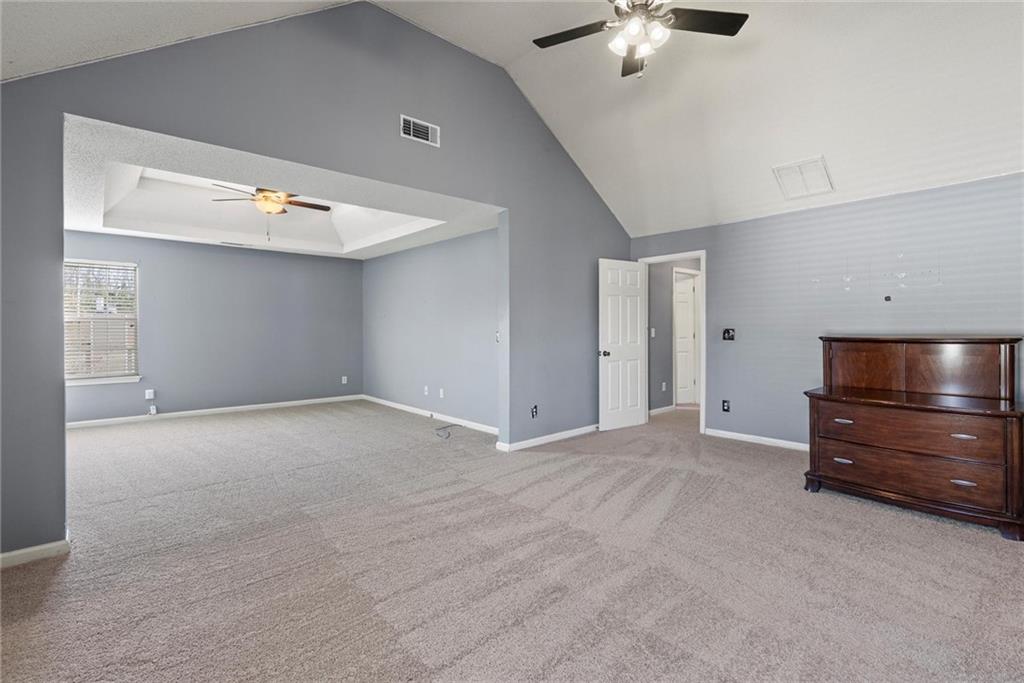 541 Hamlet Drive Hampton, GA 30228 - Photo 16 of 53 a view of an empty room with a ceiling fan