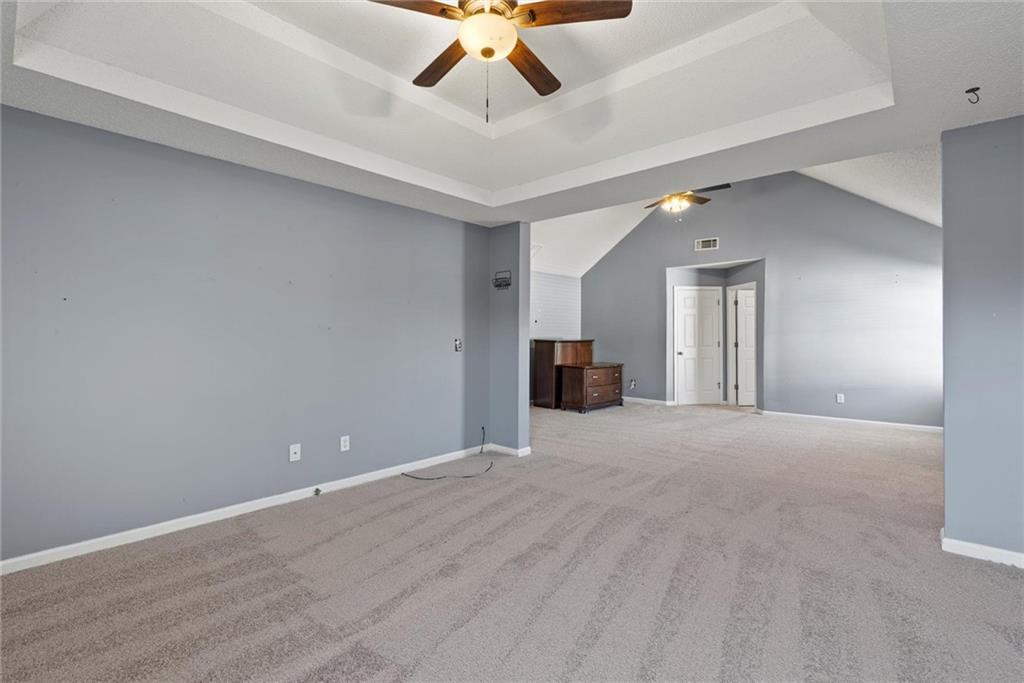 541 Hamlet Drive Hampton, GA 30228 - Photo 18 of 53 a view of an empty room with a ceiling fan and window