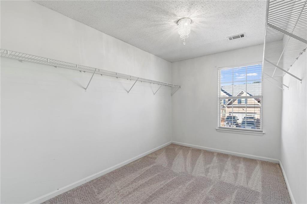541 Hamlet Drive Hampton, GA 30228 - Photo 19 of 53 a view of empty room with windows