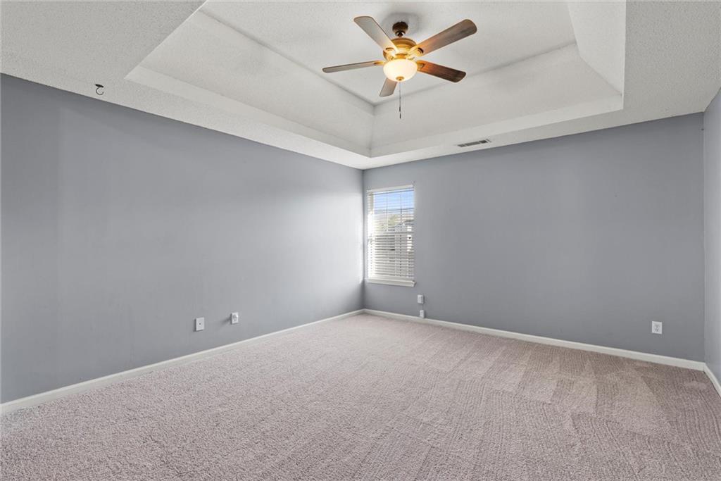 541 Hamlet Drive Hampton, GA 30228 - Photo 20 of 53 an empty room with a window and a ceiling fan