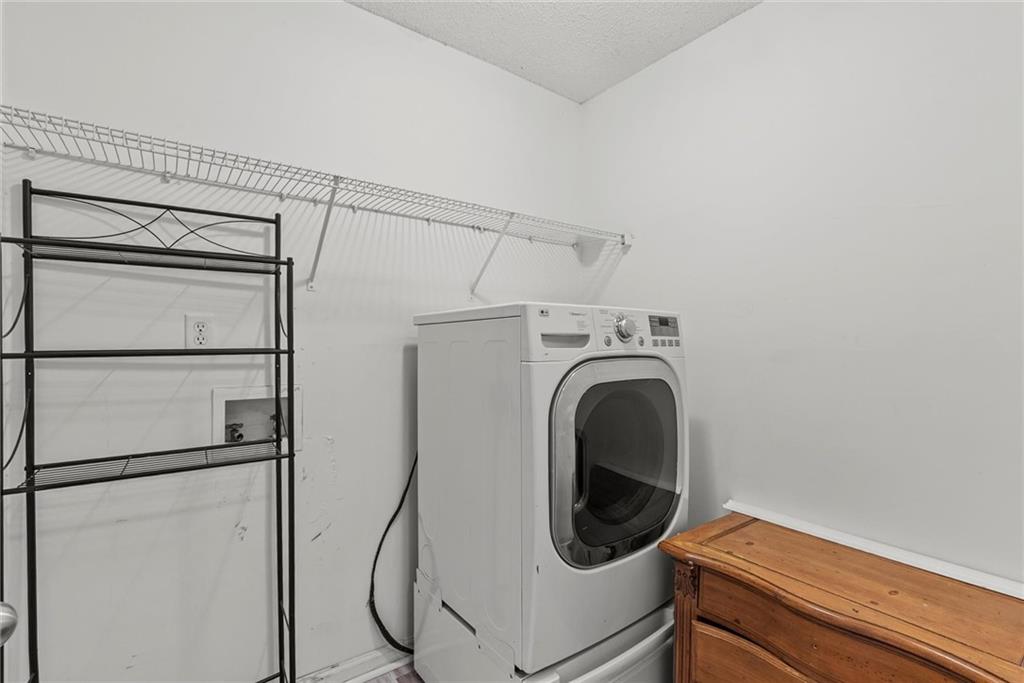 541 Hamlet Drive Hampton, GA 30228 - Photo 28 of 53 a utility room with dryer and washer